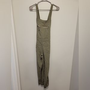 Olive overalls with zipper pocket and zipper side closure